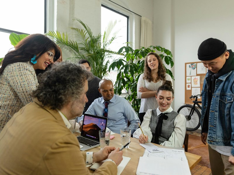 A group of workers sat around a table.