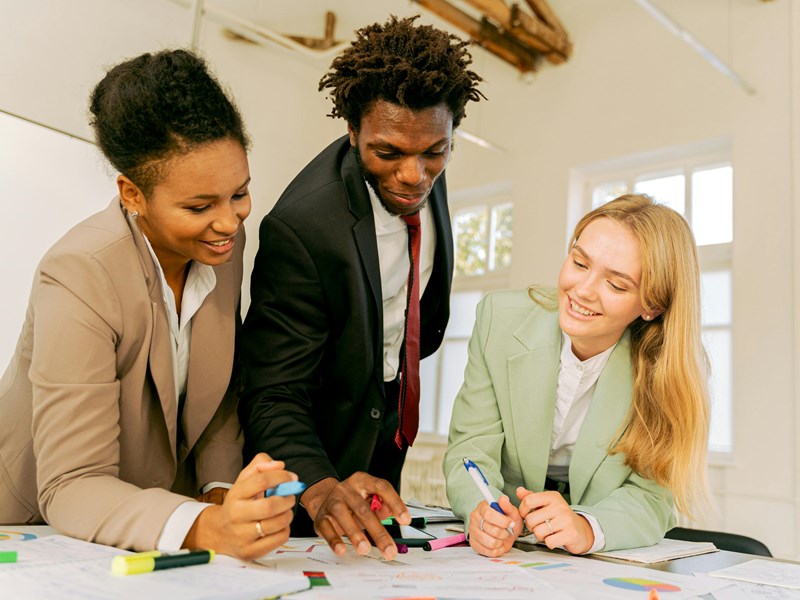 3 people working together in an office