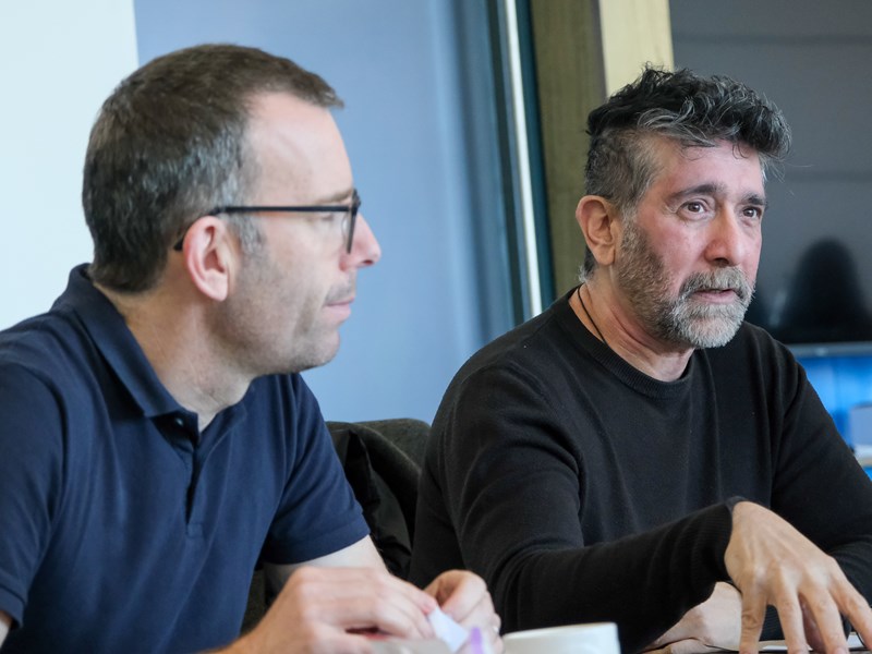 Two people conversing at a table