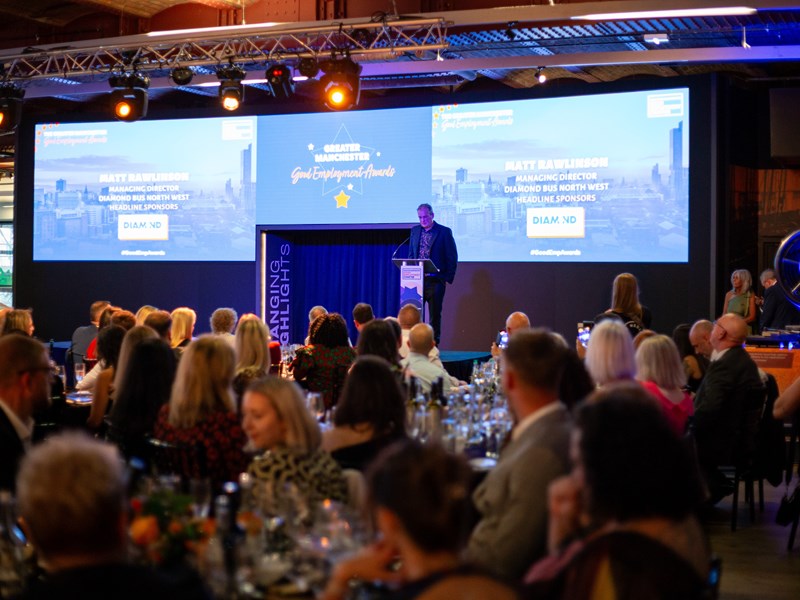 Ian MacArthur on stage at the 2025 Greater Manchester Good Employment Awards